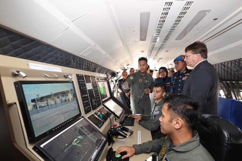 Ambassador Kagan and Gen. Tan Sri Dato’ Sri Mohd Asghar Khan bin Goriman Khan inspect the inside of the CN235 maritime surveillance aircraft (U.S. Embassy Kuala  Lumpur)